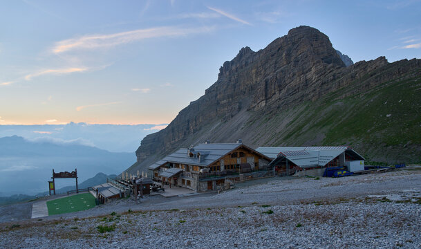 Sunset over the valley Val Rendena as seen from Passo del Groste, with Stoppani Refuge in the foreground.  The heart of the Brenta Dolomites. Summer vacation in Italy.