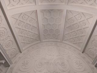 detail of the ceiling of a interior museum space with floral carvings in white