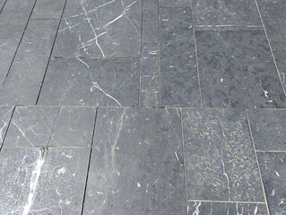 Textured with flooring in gray and white marble with different colored rectangles