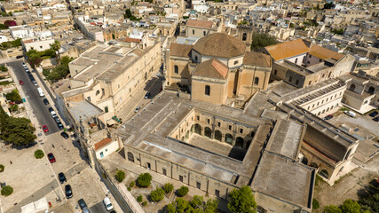 Fototapeta premium Aerial view of the Basilica of San Giovanni Battista al Rosario in Lecce, Puglia, Italy. It is a church in the historic center of the Apulian city, located near Porta Rudiae.