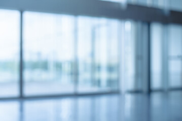 Abstract blurred image office window with soft light for background usage. Blur office window workplace interior background design concept.