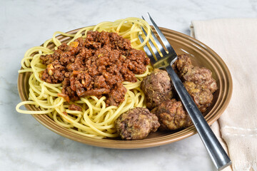 spaghetti and meat sauce   with a side of meat balls