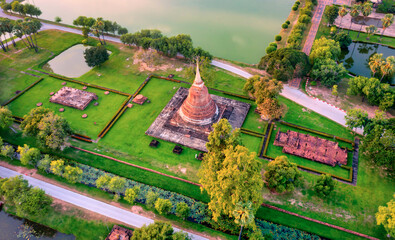 Aerial view of Ancient Buddha statue at Wat Mahathat temple in Sukhothai Historical Park, Thailand.
