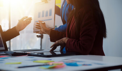 Meeting of business executives discussing analysis of the company's financial situation and business planning with partner collaboration and consultation of strategy.