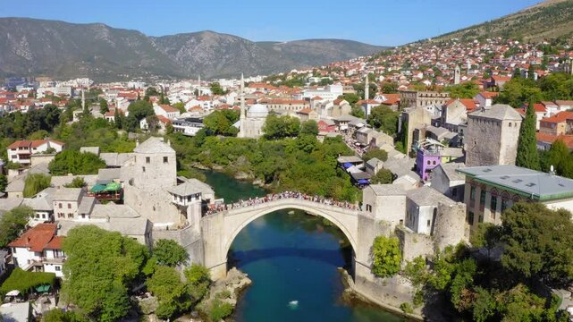 Drone view of Mostar bridge in Bosnia and Herzegovina - jumping from the bridge