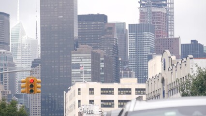 New York City street crossroad, yellow traffic light, transport road intersection, United States. Building architecture. Queens, Long Island. Manhattan cityscape, Midtown skyline, highrise skyscrapers