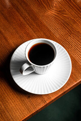 A cup of black coffee on the table in a restaurant
