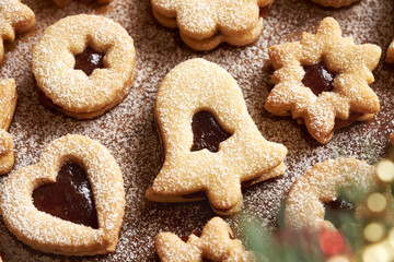 Closeup of homemade Linzer Christmas cookies filled with marmalade