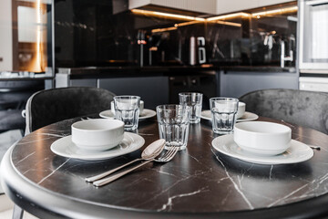 Close up shot of empty cups and plates on a black table, food and kitchen