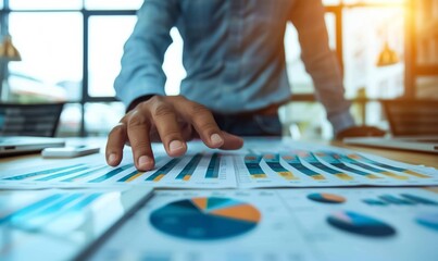 Naklejka premium man data analyst examines colorful graphs on monitors for business strategy, person looking at finance charts in office