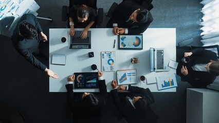 Top down aerial view of professional boss invites project manager to explain about marketing plan...