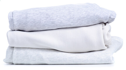 Stack folded white gray warm clothing on white background isolation