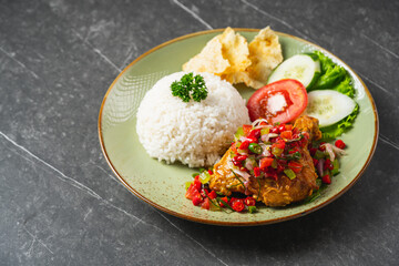 Nasi Ayam Geprek is Indonesian Food crispy fried chicken with hot and spicy sambal bawang. Served with rice