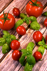 ingredients for making ketchup. ketchup in a white bowl on the table with tomatoes and basil.