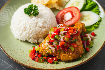 Nasi Ayam Geprek is Indonesian Food crispy fried chicken with hot and spicy sambal bawang. Served with rice