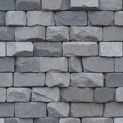 Fototapeta premium The wall is constructed from irregularly shaped, gray stones that fit together in a jigsaw-like pattern