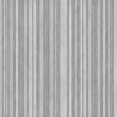 Obraz premium vertical striped pattern on a wall. The stripes are evenly spaced and have a subtle texture, resembling a marble or stone finish