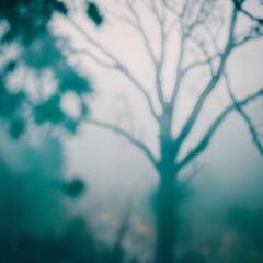 abstract photograph with a blue-green tint, likely taken through a foggy or wet surface