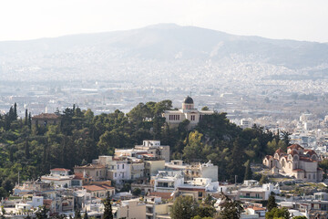 Naklejka premium The beautiful city of Athens with iconic white houses.