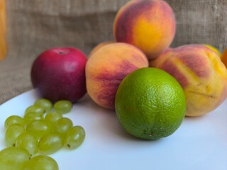 Peaches and fruits on a plate. high quality photos