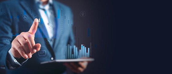 Businessman in suit touching virtual chart