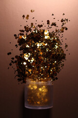 golden shiny glitter on a light brown background