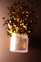 golden shiny glitter on a light brown background