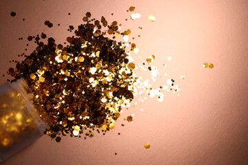 golden shiny glitter on a light brown background