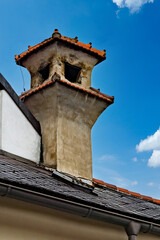 Old chimney with red bricks on a house in the Wachau valley in Lower Austria with blue sky in the Background