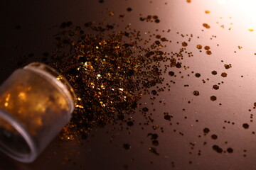 golden shiny glitter on a light brown background