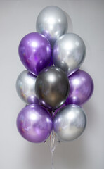 bunch of purple and black helium balloons, chrome balloons