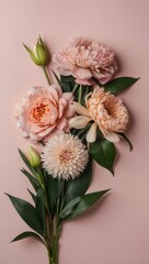 A bouquet of pink flowers is arranged in a vase