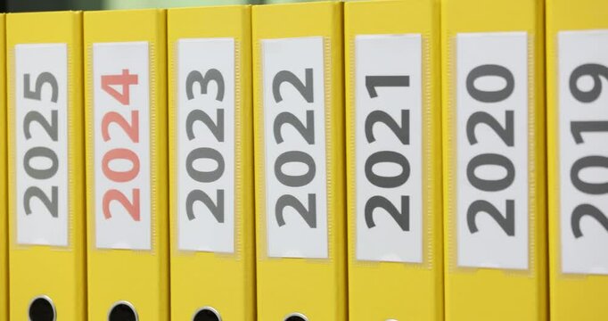 Yellow folders with dates from 2016 to 2028