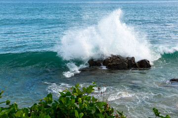 Fototapeta premium Strong sea waves breaking on a rock at the seaside. Live nature. Environment.