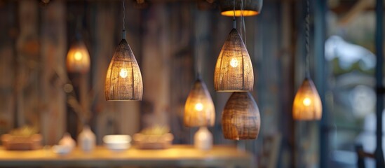 Enhance the coziness of your space with these rustic wooden pendant ceiling lights The warm hues and natural textures of the wood create a delightful and inviting atmosphere. Copy space image