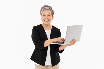 Image of adult mature business woman female manager boss wearing office clothes using holding keeping laptop computer isolated over white background looking at camera