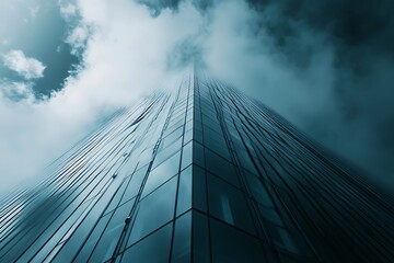 Low angle view of a skyscraper piercing through dark clouds