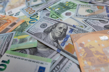 US dollar and euro banknotes background