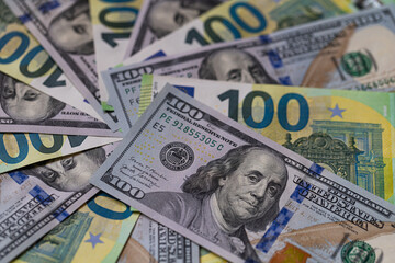 US 100 dollar and 100 euro banknotes background for design purpose