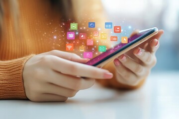 Close up of a woman s hand interacting with a smartphone and colorful app icons on white