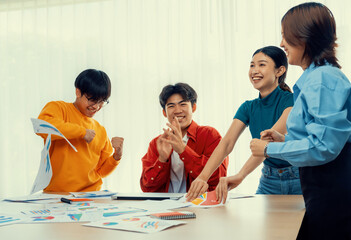 Excited and happy startup company employee celebrate after make successful strategic business...