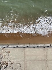 waves beside a pavement 