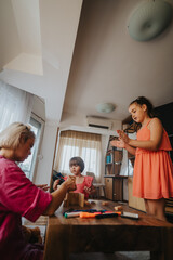 Three children engage in a creative learning activity at home, fostering imaginative play and family bonding. They interact with wooden blocks and art supplies in a cozy living room setting.