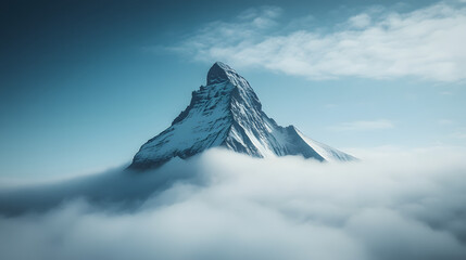 A towering mountain peak emerging from a sea of fog with just the tip of the summit visible above the clouds.
