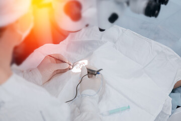 Doctor performs operation replacement of lens in eye and removal cataracts of elderly people. Lasik...