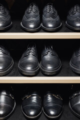 Fashion leather mens shoes in store, dark background