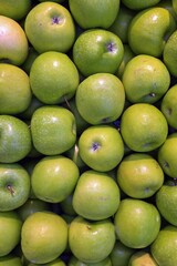 green apples stack in market