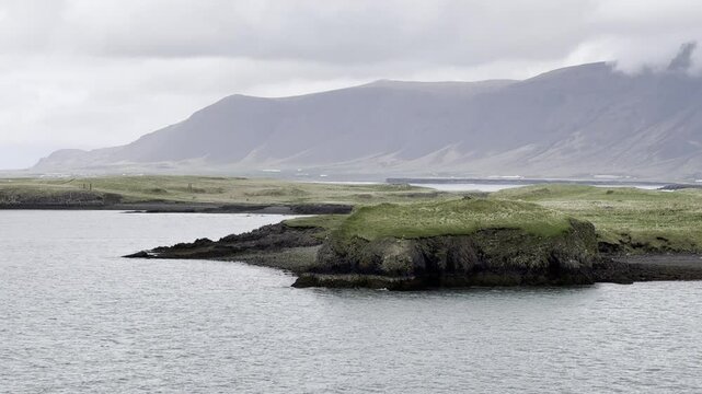 Reykjavik, Iceland - stunning landscape view during a sail away of Videy island and mountain Esjan 
