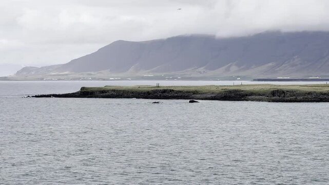 Reykjavik, Iceland - slow sail with stunning landscape view of Vesturey island and coastline of Reykjav&iacute;kurborg 
