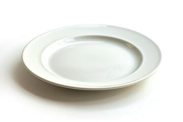 A simple white plate placed on a table with no background or distractions